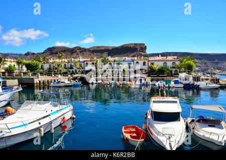 Port and promenade of beautiful romantic picturesque village Puerto de Mogan on Gran Canaria. Stock Photo