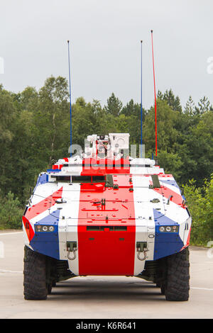 Leusden, the, Netherlands. 15th Aug, 2017. German company Rheinmetall presents its Armoured Transport Vehicle 'Boxer' as a replacement for the ageing British armoured vehicles. For the occasion a Boxer is wrapped in the British Union Jack flag. Pictures taken in August 2017 but under embargo until 13 September 2017 when DSEI takes place in London where Rheinmetall presents the Boxer. Credit: Astrid Hinderks/Alamy Live News Stock Photo