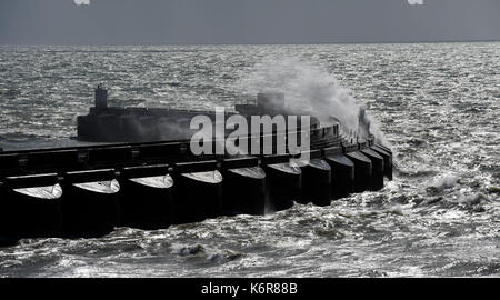 Brighton, UK. 13th Sep, 2017. UK Weather. Waves crash over Brighton Marina on a windy day on the south coast as Storm Aileen blows across Britain today Credit: Simon Dack/Alamy Live News Stock Photo