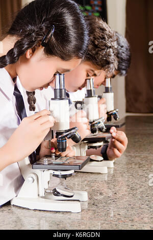 Indian School Students Checking Microscope Science Laboratory Research Stock Photo