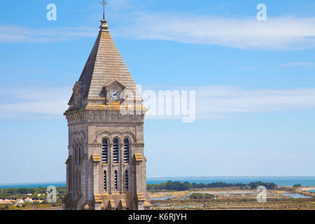 View at church tower on island of Noirmoutier in France with blue sky Stock Photo