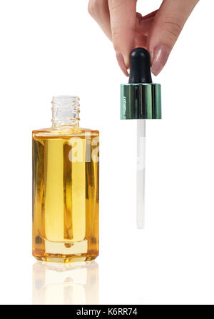 Cosmetic bottle of oil with pipette. Stock Photo
