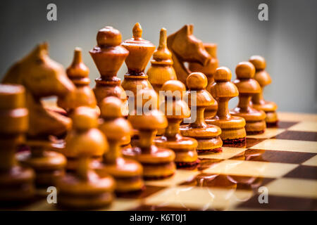 Set of white chess pieces on the board close up. Stock Photo