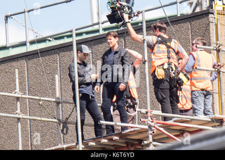Tom Cruise leaps from the roof of one building to another while filming the next film in the 'Mission: Impossible' series; Cruise appeared to injure himself in the stunt and required medical treatment.  The 55-year-old action man was injured during a big building-jump stunt on the set of the blockbuster in London on Sunday (13Aug17) - which was caught on camera. Cruise appeared to miss his mark while jumping from construction rigging onto a nearby building, and slammed gainst the wall. Clambering up the wall and getting to his feet, the movie star limped for a few yards and then collapsed in  Stock Photo