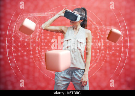 Visual reality concept. Young man using Visual reality or VR headset and interacting with object Stock Photo