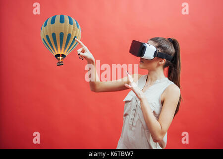 Visual reality concept. Young man using Visual reality or VR headset and interacting with object Stock Photo