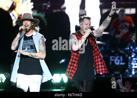 Brian Kelley (L) and Tyler Hubbard of Florida Georgia Line perform at Northwell Health at Jones Beach Theatre on June 15, 2017 in Wantagh, New York. Stock Photo