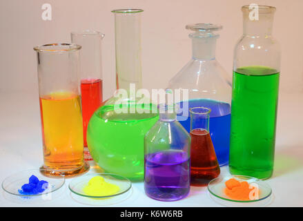 Colorful liquids and powders in laboratorium glassware. Stock Photo