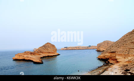 Beach with Rocky Mountains at muscat Stock Photo