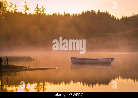 Capturing Sunrise on Loch Rusky, Nr Aberfoyle, Central Scotland Stock Photo