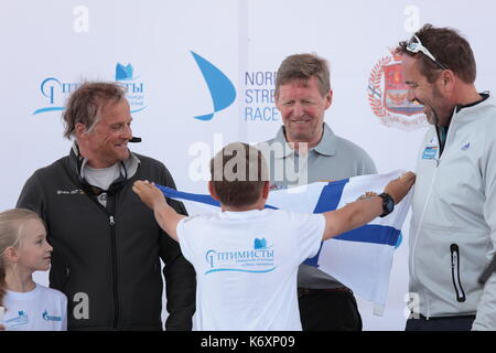 St. Petersburg, Russia - June 4, 2016: Skipper Alexander Holstein of Germany get a pennant from the teen athlete during the opening ceremony of the No Stock Photo