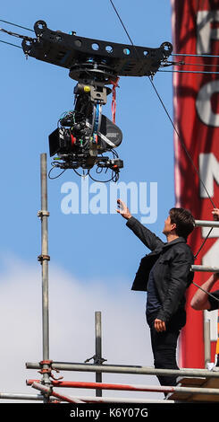 Tom Cruise jumps between two buildings in a scene from the new Mission Impossible film  The 55-year-old action man was injured during a big building-jump stunt on the set of the blockbuster in London on Sunday (13Aug17) - which was caught on camera. Cruise appeared to miss his mark while jumping from construction rigging onto a nearby building, and slammed gainst the wall. Clambering up the wall and getting to his feet, the movie star limped for a few yards and then collapsed in front of the film crew. Filming was halted as Tom was checked out by members of the on-set safety team. The footage  Stock Photo