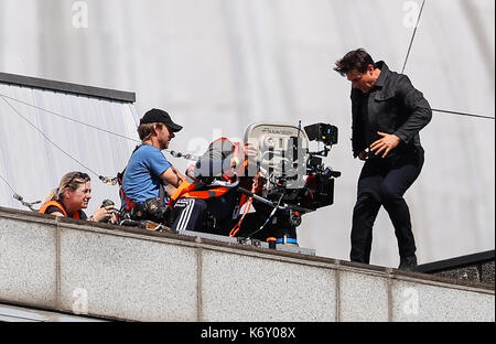 Tom Cruise jumps between two buildings in a scene from the new Mission Impossible film  The 55-year-old action man was injured during a big building-jump stunt on the set of the blockbuster in London on Sunday (13Aug17) - which was caught on camera. Cruise appeared to miss his mark while jumping from construction rigging onto a nearby building, and slammed gainst the wall. Clambering up the wall and getting to his feet, the movie star limped for a few yards and then collapsed in front of the film crew. Filming was halted as Tom was checked out by members of the on-set safety team. The footage  Stock Photo