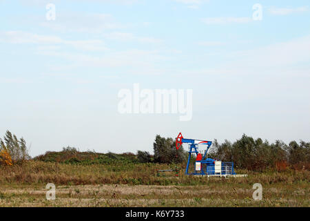 oil pump jack on oilfield Stock Photo