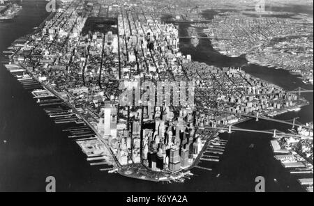 Manhattan Island showing at the left foreground the incomplete World Trade Center, whose twin towers make it the tallest building on Earth. New York City, 1971. Stock Photo