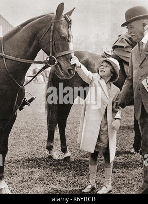 Princess Elizabeth at the Richmond Horse Show in 1934.  Princess Elizabeth of York, future Elizabeth II, 1926 - 2022. Queen of the United Kingdom.  From The Coronation Book of King George VI and Queen Elizabeth, published 1937. Stock Photo