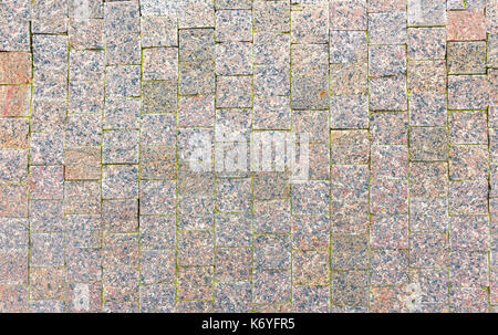 Texture of cobblestone road close-up. Stock Photo