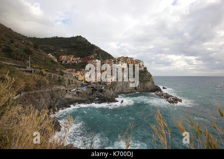 the beautiful pastel colored houses of Manarola, Le Cinque Terre, Italy, from a distance, photoarkive Stock Photo