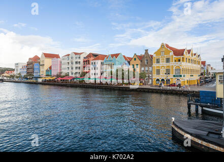 Restaurants, shops and colorful buildings along the water in Curaçao. Stock Photo