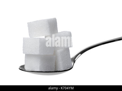 close up of sugar cubes in a spoon Stock Photo