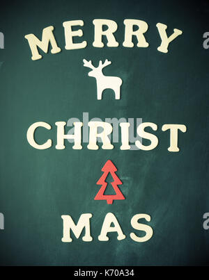 Seasonal background on a blackboard with the words Merry Christmas Stock Photo