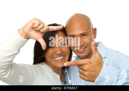 Asian couple making picture hand gestures. Stock Photo
