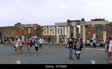 POMPEII, ITALY - June 25, 2014; Famous UNESCO heritage antique ruins in Pompeii, Italy - June 25, 2014; Large square with remains of destroyed ancient Stock Photo