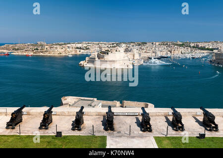 View of Grand Harbour Marina, Fort Saint Angelo and the Birgu district seen from the Saluting Battery in the old town of Valletta, the capital of Malt Stock Photo