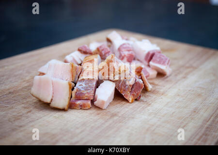 Fresh bacon on the wooden chopping board Stock Photo