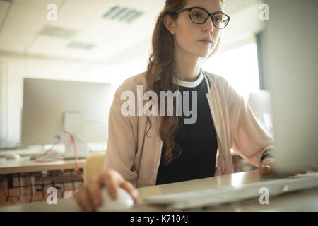 Beautiful woman working on computer in college Stock Photo