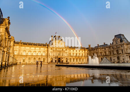 Rainbow over the Louvre in Paris Stock Photo