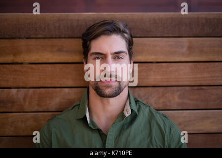 Portrait of man relaxing in cottage Stock Photo