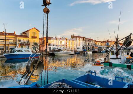 France, Gard, Le Grau du Roi, Site protected by the Conservatoire du Littoral, boats moored on the canal Stock Photo