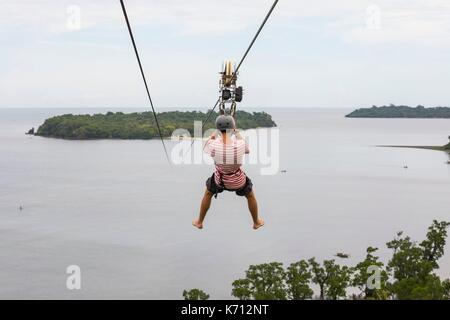 Philippines, Mindoro Island, Occidental Mindoro, Municipality of Sablayan, zipline in Parola Park Hill between 2 islands Stock Photo