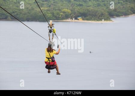 Philippines, Mindoro Island, Occidental Mindoro, Municipality of Sablayan, zipline in Parola Park Hill between 2 islands Stock Photo