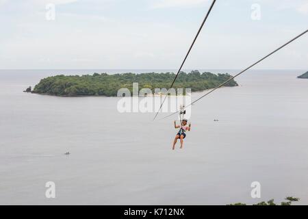 Philippines, Mindoro Island, Occidental Mindoro, Municipality of Sablayan, zipline in Parola Park Hill between 2 islands Stock Photo