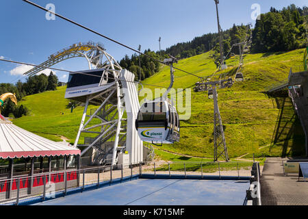 SCHLADMING, AUSTRIA - AUGUST 15: Tourists travel in cable car to Planai bike and ski areal on August 15, 2017 in Schladming, Austria. Stock Photo