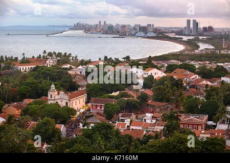 Brazil, Pernambuco, Olinda, Historic Center classified World Heritage of Humanity by UNESCO, Aerial view of the historic center with the church of Sao Pedro Apostolo, and the city of Recife in the background Stock Photo