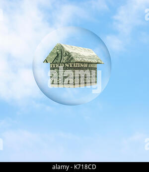 Housing market bubble. Origami cash home bubble on a blue sky. Stock Photo