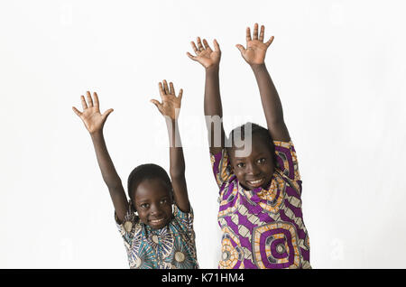 Two beautiful African children playing and having fun by showing their hands, isolated on white Stock Photo