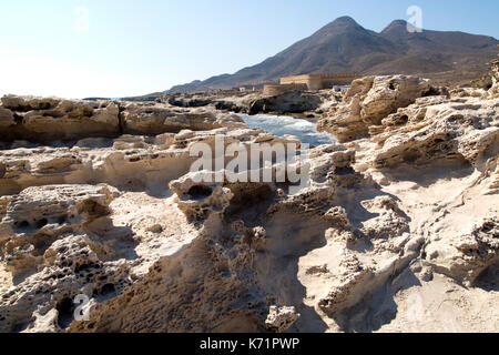 Volcanoes and fossilised sand dune rock structure, Los Escullos, Cabo de Gata natural park, Almeria, Spain Stock Photo