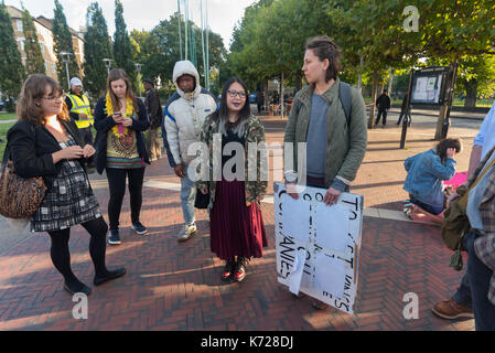 London, UK. 14th September 2017. Campaigners from 'Stop Killing Londoners' meet at Windrush Square before walking to the crossing at Brixton Underground station. They then walked onto the pedestrian crossing and stopped traffic in a protest against London's excessive air pollution, due mainly to traffic. The air on the Brixton Road breaches the annual pollution limit in only 5 days, roughly 70 times the limit per year. Toxic air pollution results in 10,000 premature deaths in London each year and is particularly harmful to the elderly and the very young. To cut the disruption to traffic they m Stock Photo