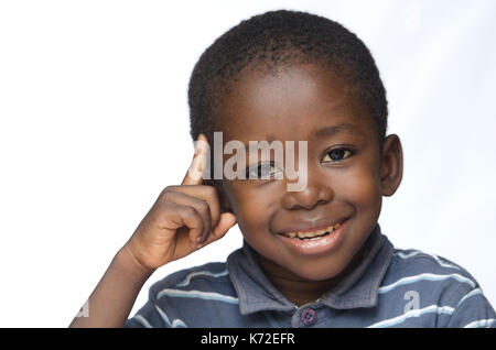 African boy holding his hand out as a STOP sign for racism and abuse Stock Photo