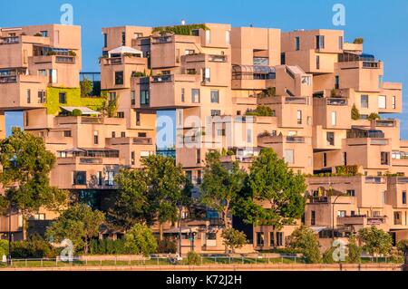 Canada,Province of Quebec,Montreal,Habitat 67,or simply Habitat,is a model community and housing complex in Montreal,Canada,designed by Israeli&#x2013;Canadian architect Moshe Safdie,it was originally conceived as his master's thesis in architecture at McGill University and then built as a pavilion for Expo 67,the World's Fair held from April to October 1967,it is located at 2600 Avenue Pierre-Dupuy on the Marc-Drouin Quay next to the Saint Lawrence River,Habitat 67 is widely considered an architectural landmark and one of the most recognizable and significant buildings in both Montreal Stock Photo