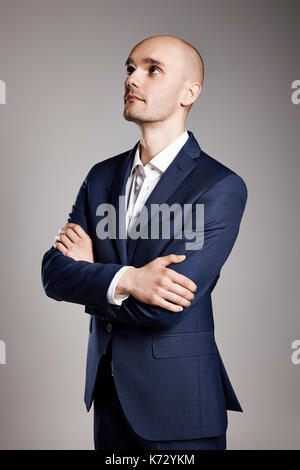 Portrait of young pensive man looking up. Stock Photo