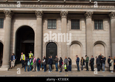 People queue outside the Bank of England in London, to exchange money for the new ten pound note featuring Jane Austen. Stock Photo