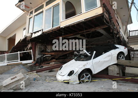Beachfront homes lie in ruin in the aftermath of Hurricane Sandy in the Rockaways, New York, New York on November 4, 2012. Stock Photo