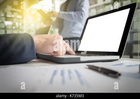 Teamwork process, Image of two young businessmen using laptop at meeting. Stock Photo