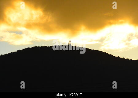 Telephoto shot of a hill at sunset Stock Photo