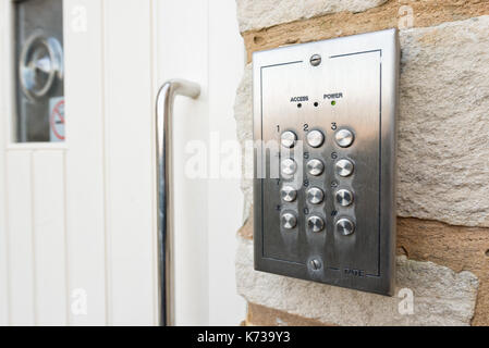 The keypad of a door entry security system at a residential home, in a gated community.Ensuring access is only possible for residents and their guests Stock Photo